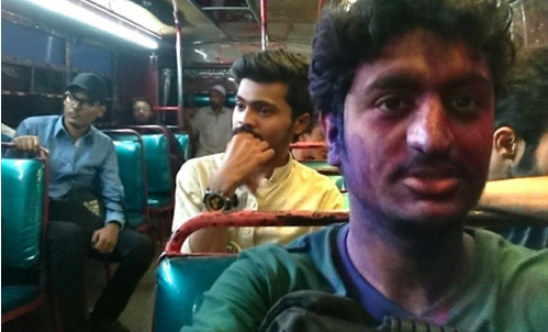 Pakistani Man Boards A Bus After Playing Holi