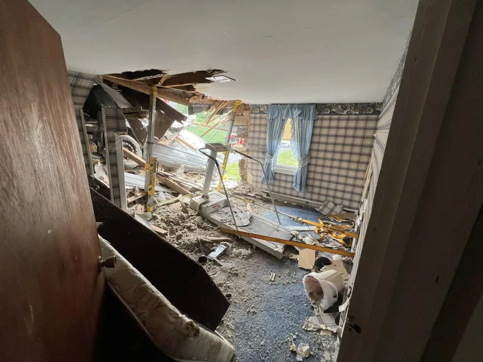 Car Crashes Into Second Floor Of House